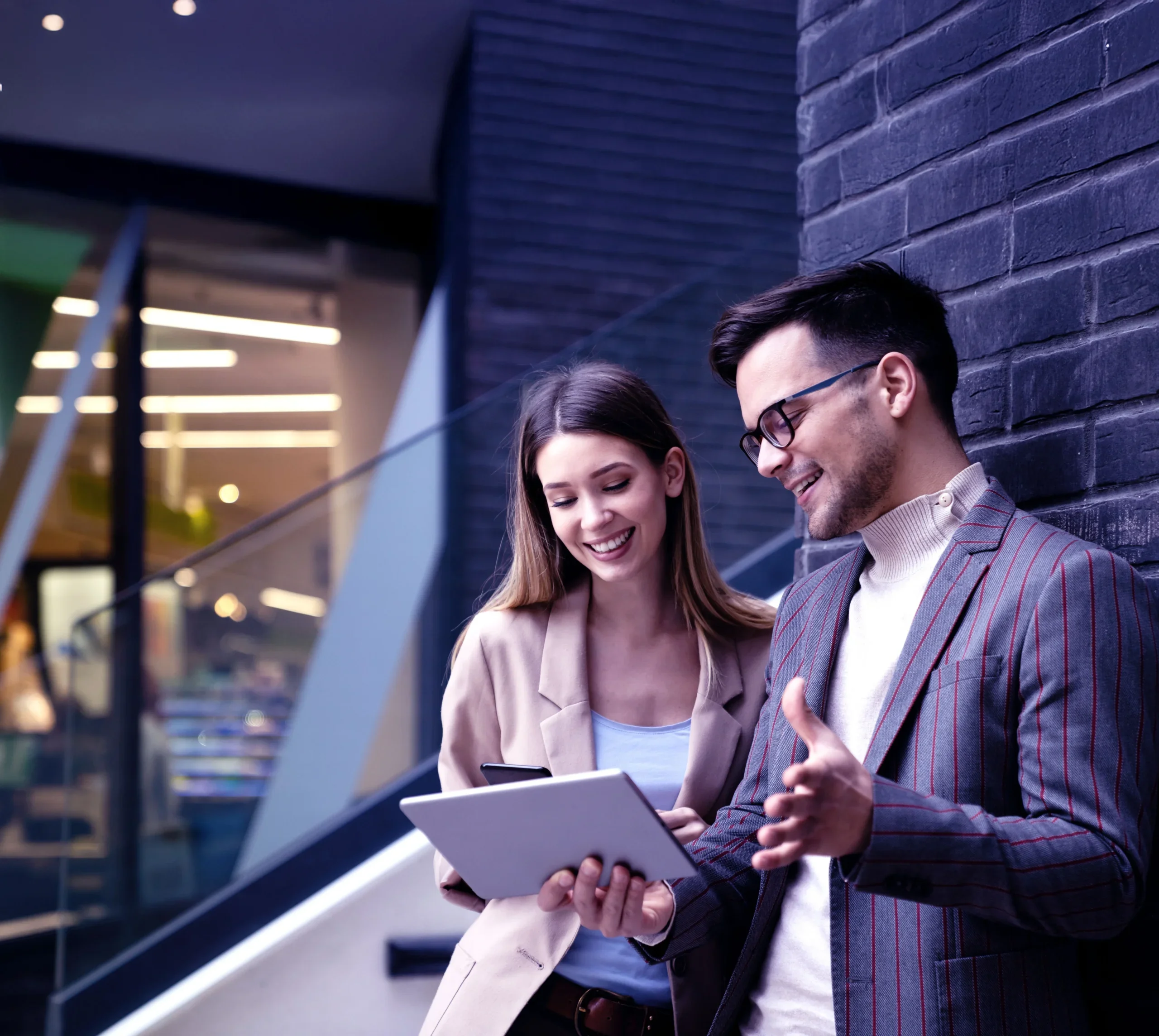 A man showing project details to the lady